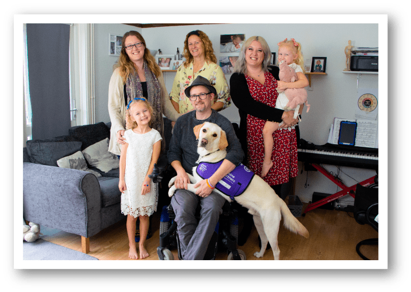 Sean and his family with canine partner Lucas